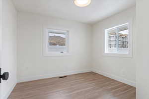 Spare room featuring light hardwood / wood-style floors