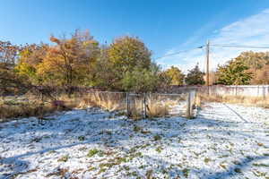 View of yard covered in snow