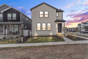 View of front of home beautifully lit up