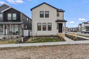 Front of home from walking path and open space in front of home