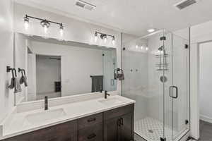 Master bedroom bathroom with walk in shower and walk in closet to left