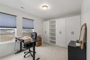 Bedroom 3 upstairs with custom built in shelves, used as office space