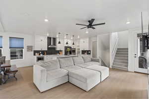 Spacious living room with open concept and high ceilings with dining area and kitchen