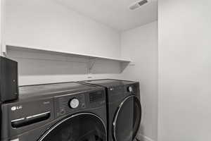 Laundry room upstairs next to master bedroom off loft