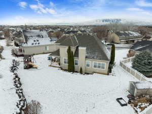 Snowy aerial view featuring a mountain view