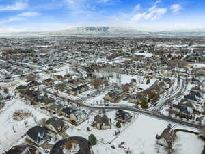 Snowy aerial view featuring a mountain view