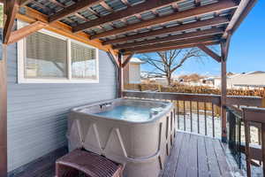 Wooden deck with a hot tub