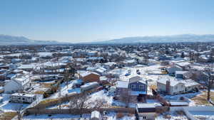 Snowy aerial view featuring a mountain view