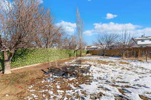 View of yard layered in snow