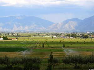 View of mountain feature featuring a water view and a rural view