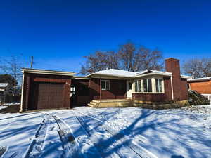 Single story home with a garage