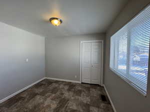 Unfurnished bedroom featuring a closet