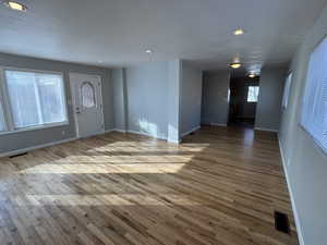 Entrance foyer featuring hardwood / wood-style floors