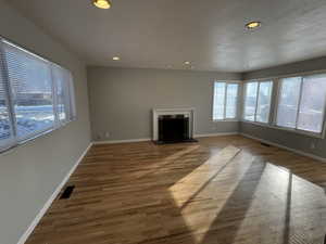 Unfurnished living room with hardwood / wood-style floors