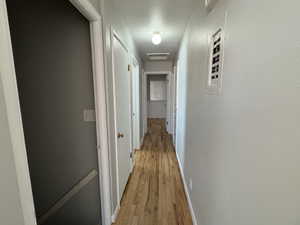 Hallway featuring light wood-type flooring