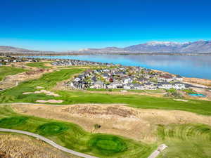 Birds eye view of property featuring a water and mountain view