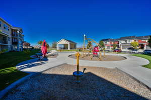 View of playground with a yard