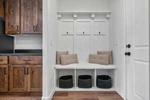 Mudroom with hardwood / wood-style floors