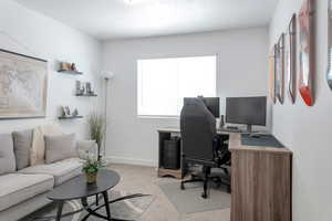 View of carpeted home office