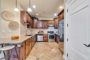 Kitchen has bar stool seating