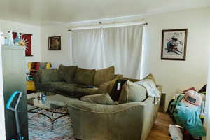 Living room with hardwood / wood-style floors