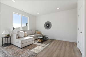 Living room with light wood-type flooring