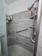 Bathroom with tiled shower