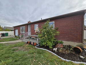 View of front facade with a garage and a front lawn