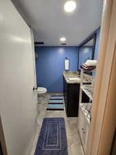 Bathroom featuring vanity and toilet