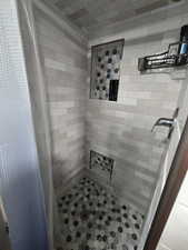 Bathroom with curtained shower