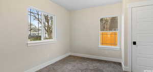 Spare bedroom featuring newer carpet and paint