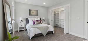 Master Bedroom featuring large walk in closets