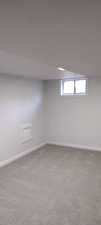 Unfurnished room featuring carpet floors