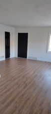 Unfurnished room with hardwood / wood-style flooring