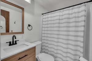 Bathroom with vanity and toilet