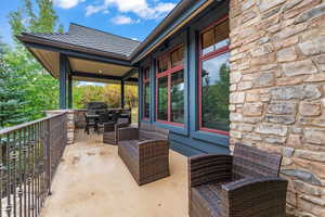 View of patio featuring a balcony, grilling area, and outdoor lounge area