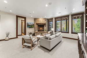 Carpeted living room with a fireplace