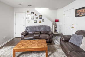 Living room featuring dark hardwood / wood-style floors