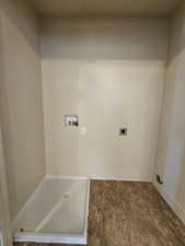 Laundry room with hookup for a washing machine and electric dryer hookup