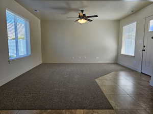 Entryway with ceiling fan, a healthy amount of sunlight, and a textured ceiling