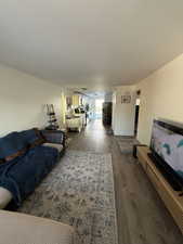 Living room with hardwood / wood-style floors