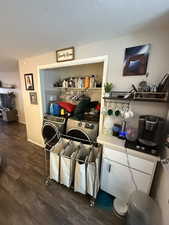 Interior space with hardwood / wood-style floors and washer and dryer