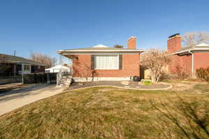 View of front of property with a front yard