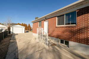 View of home's exterior with an outbuilding and a garage