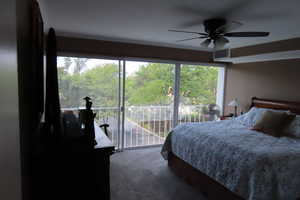 Bedroom with access to outside and ceiling fan