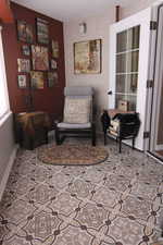 Sitting room with brick wall