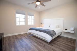 Bedroom featuring dark hardwood / wood-style floors and ceiling fan