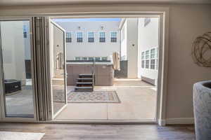 Entryway with light hardwood / wood-style floors