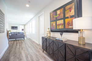 Hallway with wood-type flooring