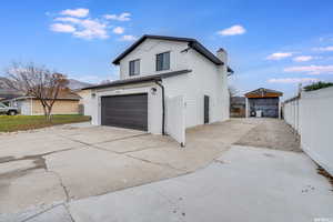 View of side of home with a garage